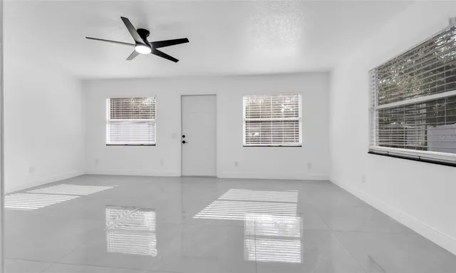 a view of an empty room with a window