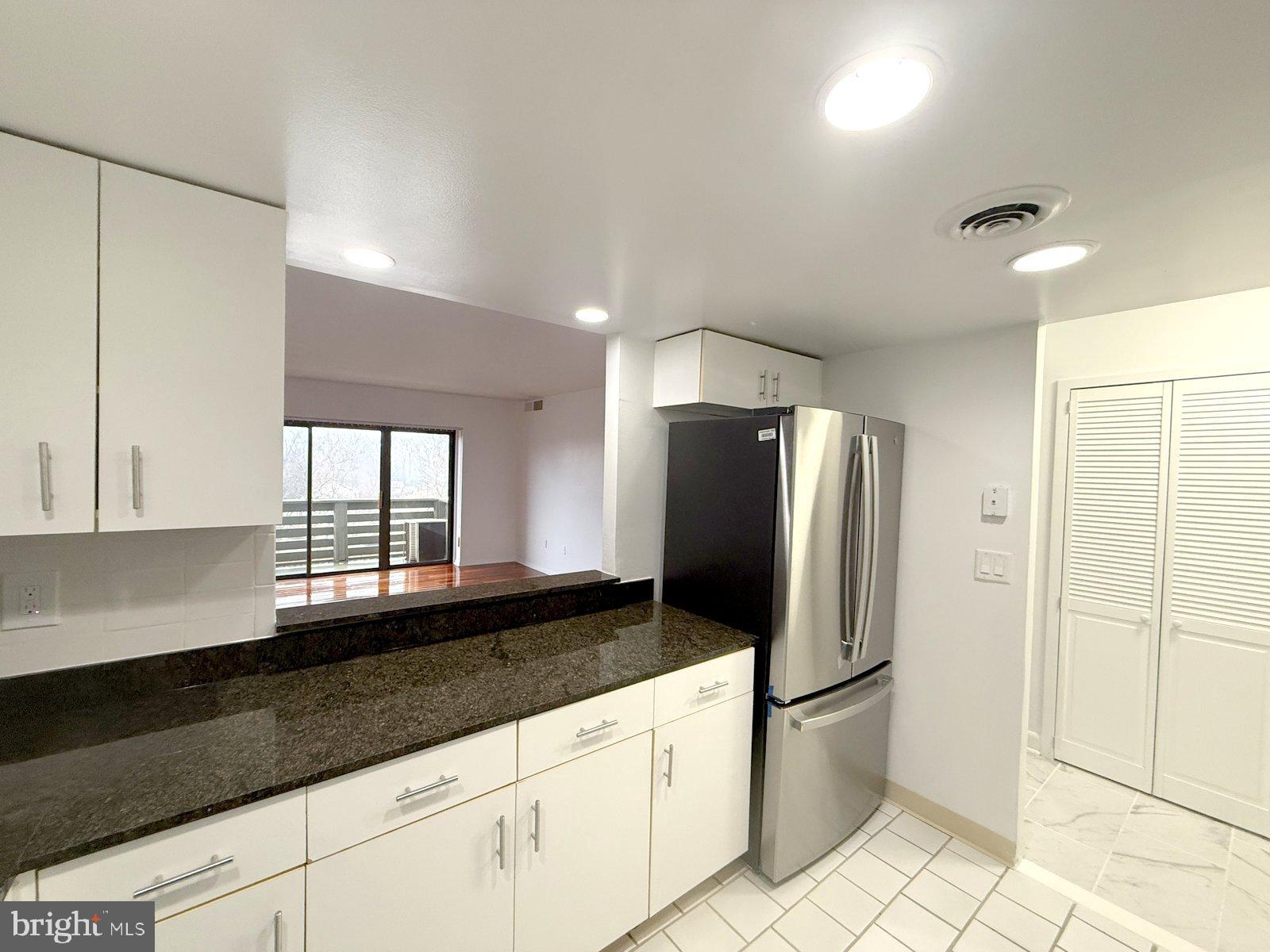 606 Cooper Landing Road, Unit B6A Cherry Hill, NJ 08002 - Photo 4 of 11 a kitchen with stainless steel appliances granite countertop a refrigerator a sink and a granite counter tops