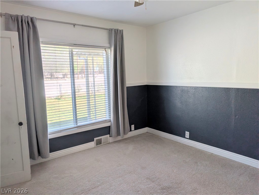 1 South 5th Street Panaca, NV 89042 - Photo 11 of 21 Second bedroom featuring light carpet and a ceiling fan