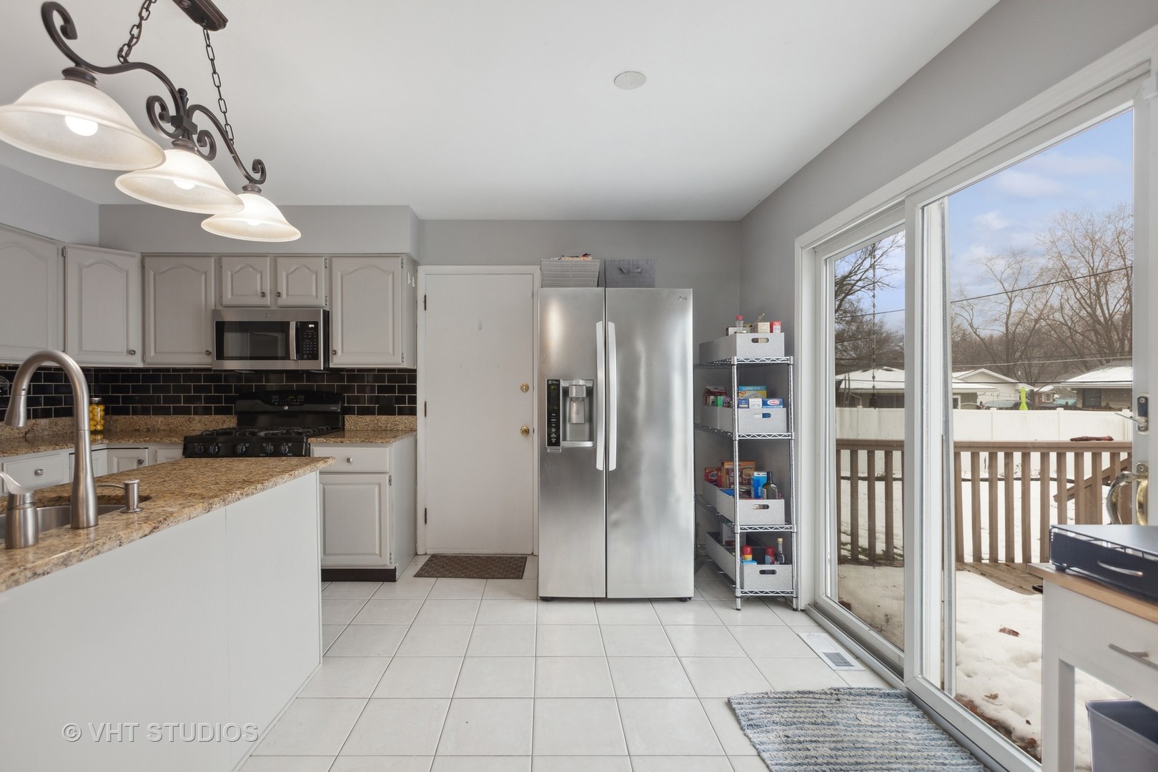1216 Modaff Road Naperville, IL 60540 - Photo 7 of 25 a kitchen with stainless steel appliances granite countertop a refrigerator and a sink