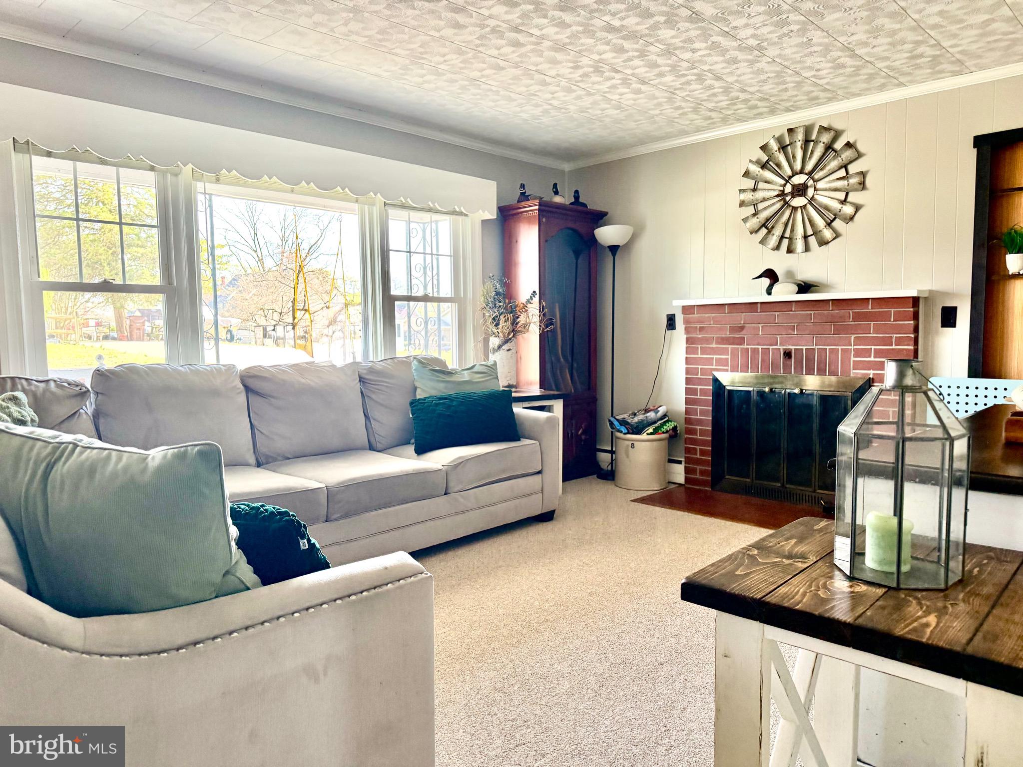 202 4th Street Sharptown, MD 21861 - Photo 16 of 73 a living room with furniture and a window