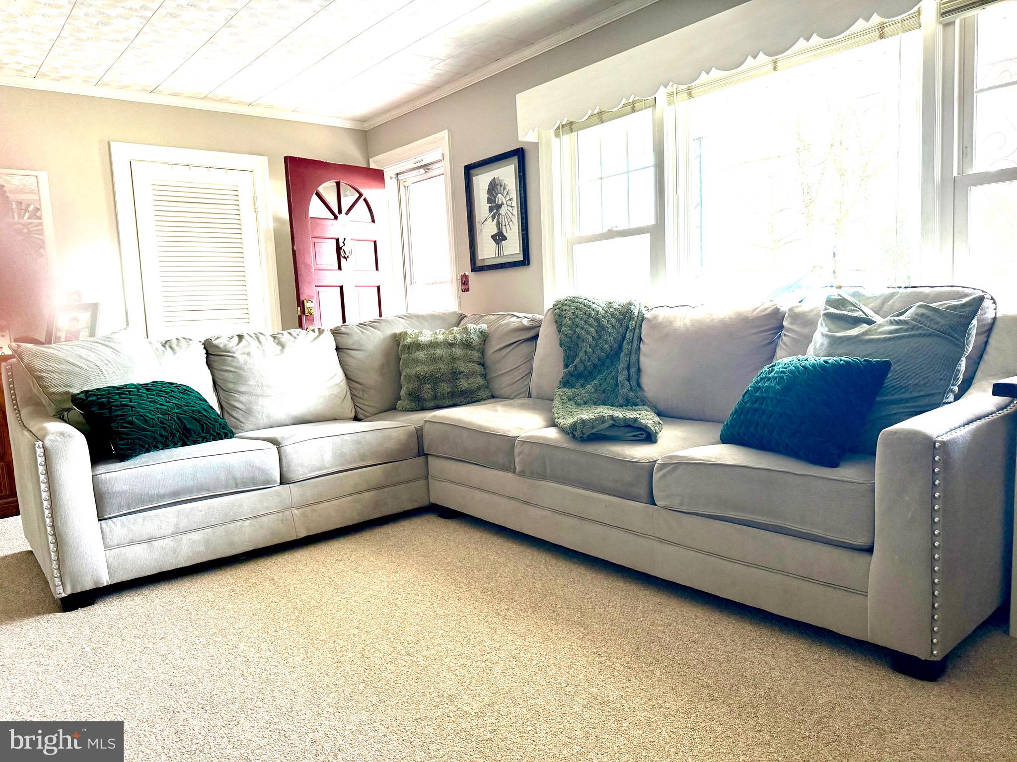 202 4th Street Sharptown, MD 21861 - Photo 17 of 73 a living room with furniture and a large window