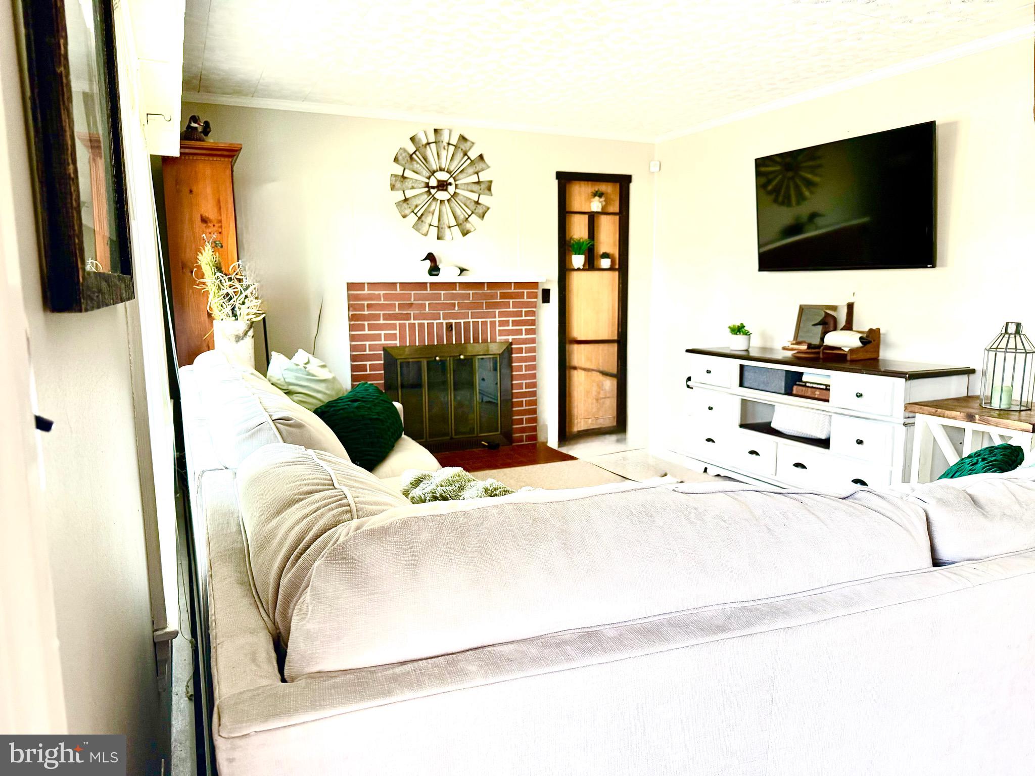 202 4th Street Sharptown, MD 21861 - Photo 35 of 73 a bedroom with a bed and flat screen tv