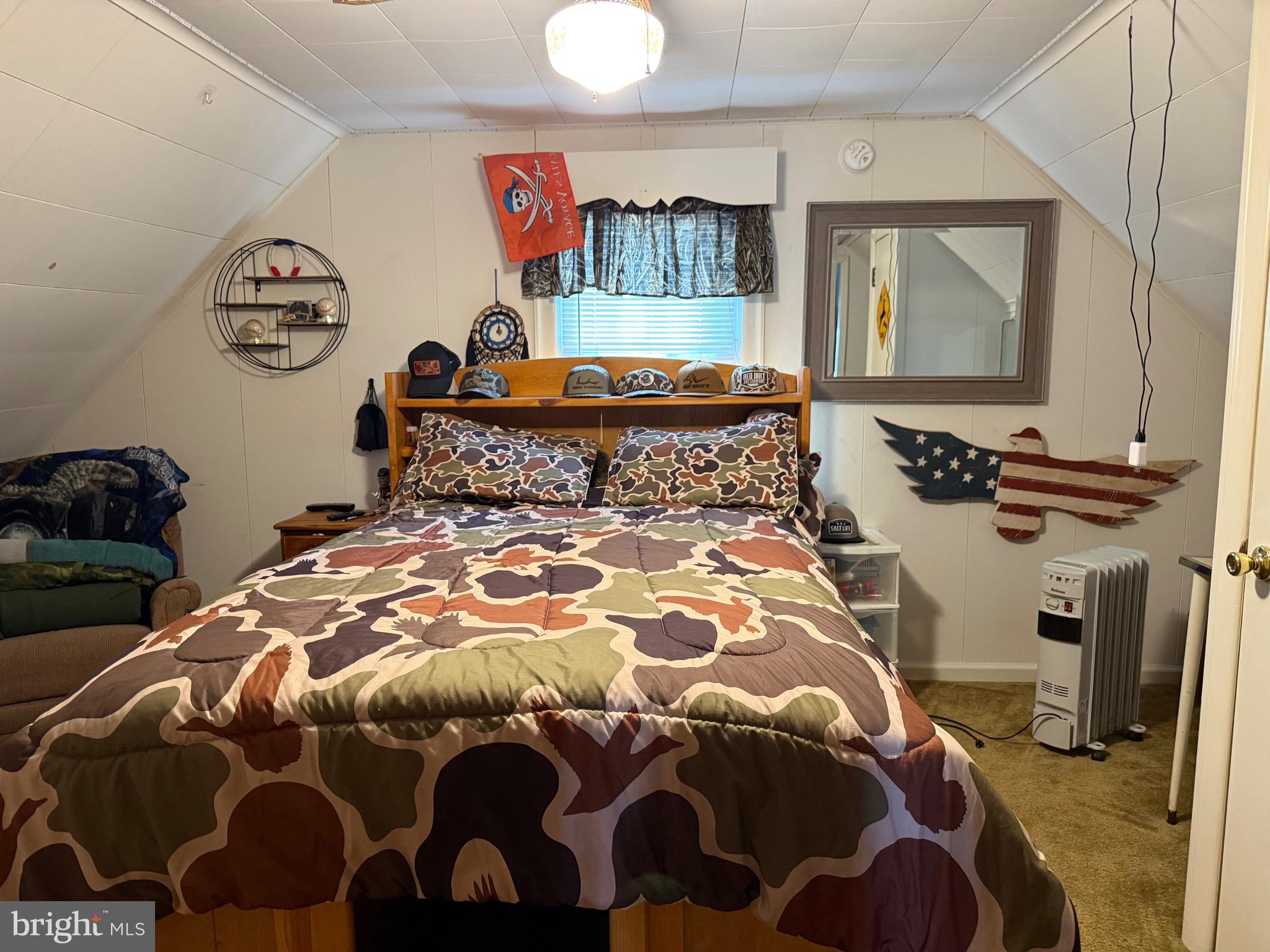 202 4th Street Sharptown, MD 21861 - Photo 51 of 73 a bedroom with a bed and a mirror on the dresser