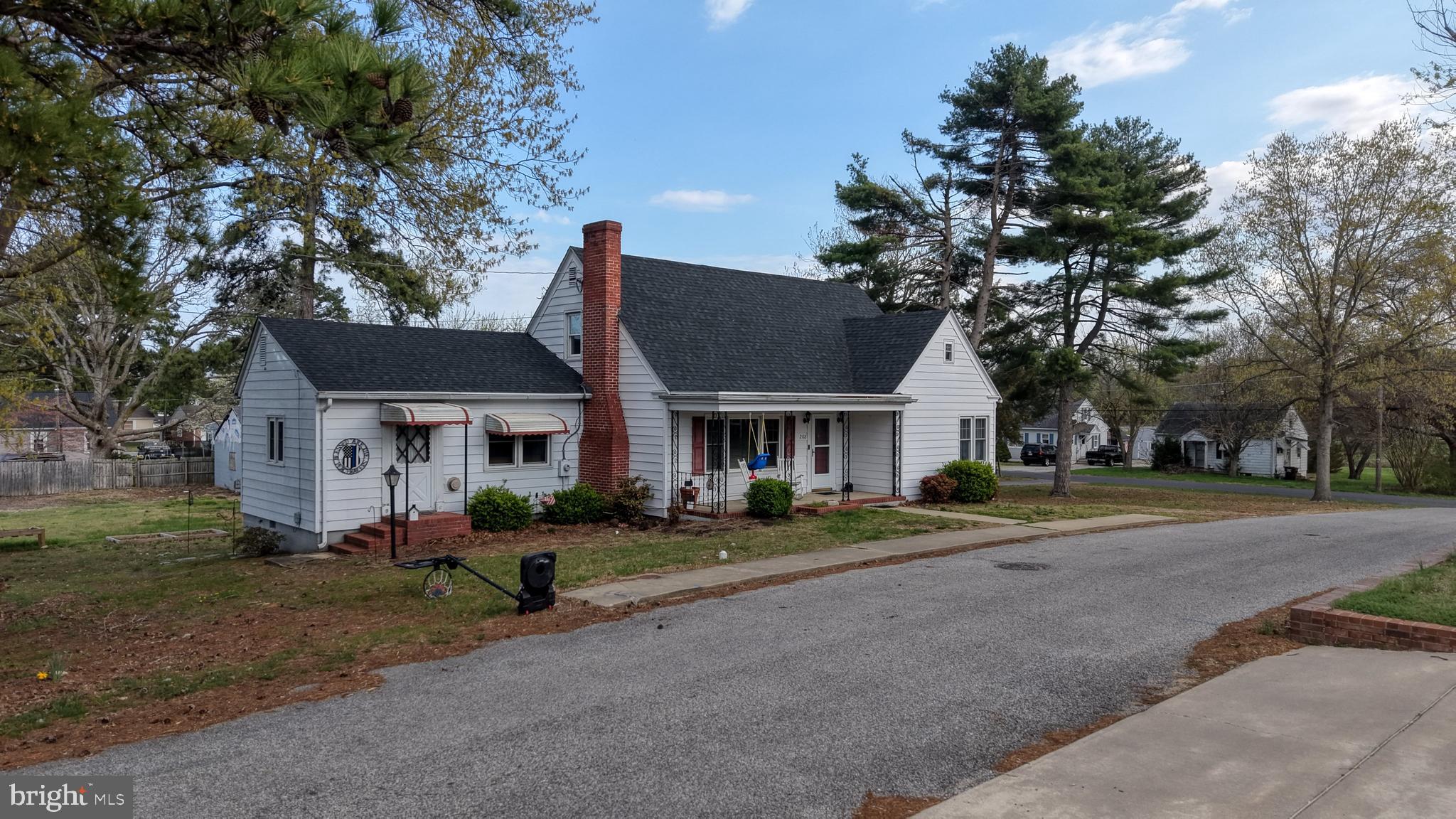 202 4th Street Sharptown, MD 21861 - Photo 7 of 73 a front view of a house with a yard