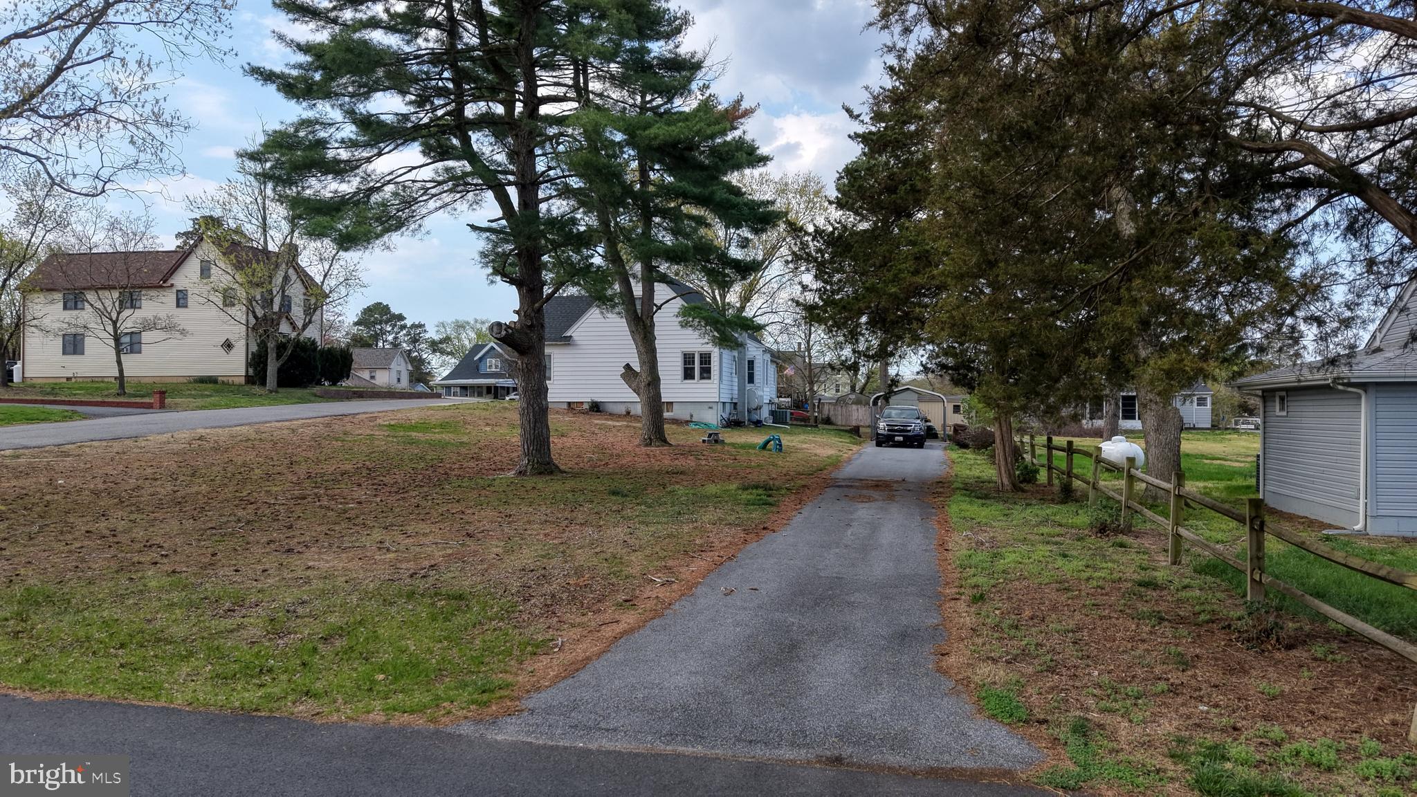 202 4th Street Sharptown, MD 21861 - Photo 10 of 73 a view of a yard with plants and trees