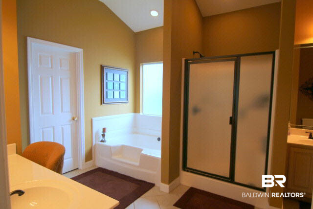 7263 Highpointe Place East Daphne, AL 36527 - Photo 16 of 22 This Master Bath features a separate shower and tub as well as his and hers vanities (hers has a makeup area)!
