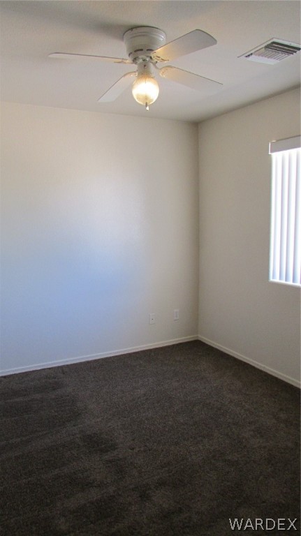 2188 Jamie Road Fort Mohave, AZ 86426 - Photo 14 of 21 an empty room with a window and ceiling fan