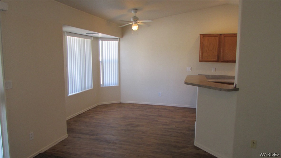 2188 Jamie Road Fort Mohave, AZ 86426 - Photo 5 of 21 an empty room with windows and cabinet