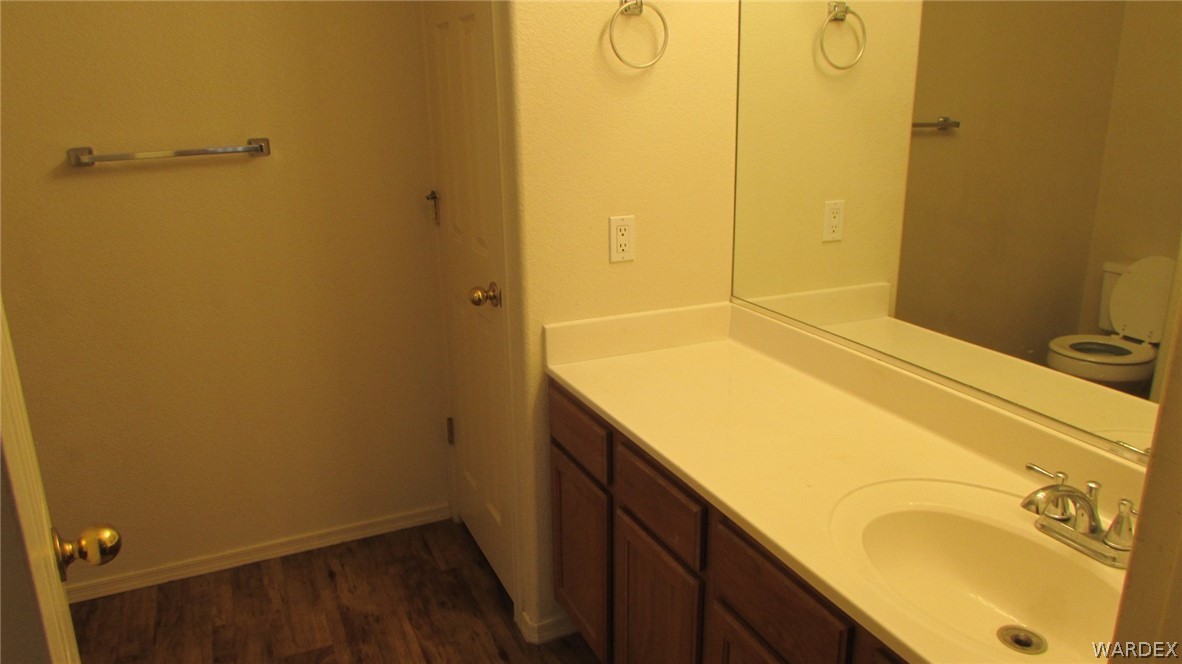 2188 Jamie Road Fort Mohave, AZ 86426 - Photo 9 of 21 a bathroom with a granite countertop sink and a mirror