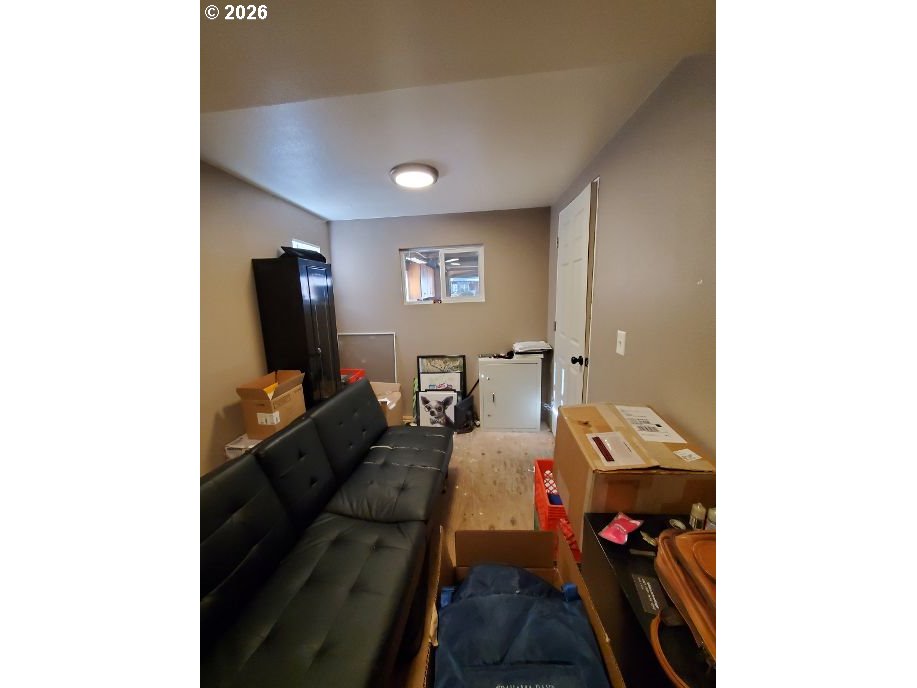 243 North Lane Street Cottage Grove, OR 97424 - Photo 12 of 22 a living room with furniture and a flat screen tv