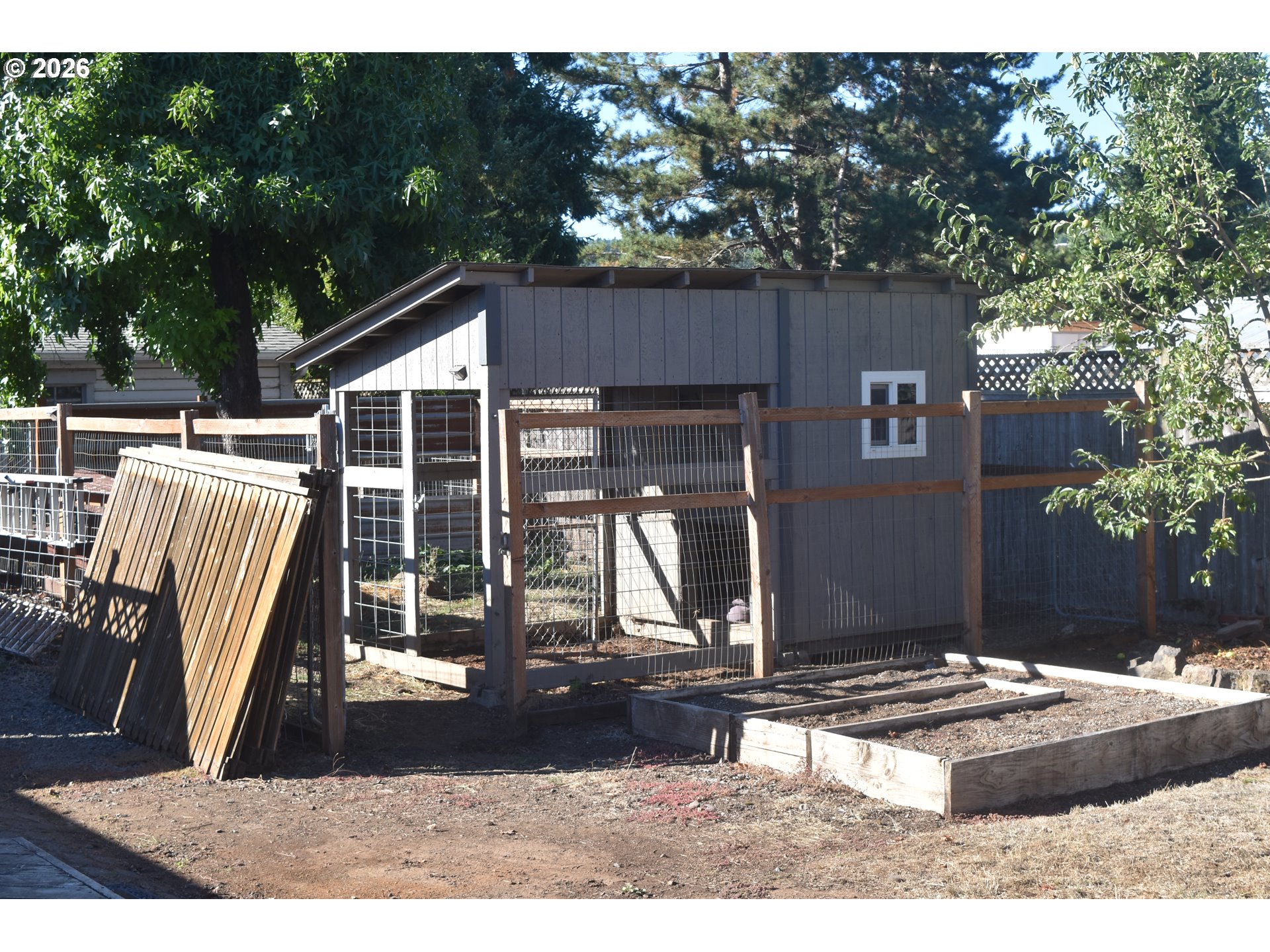 243 North Lane Street Cottage Grove, OR 97424 - Photo 18 of 22 a backyard of a house with barbeque oven