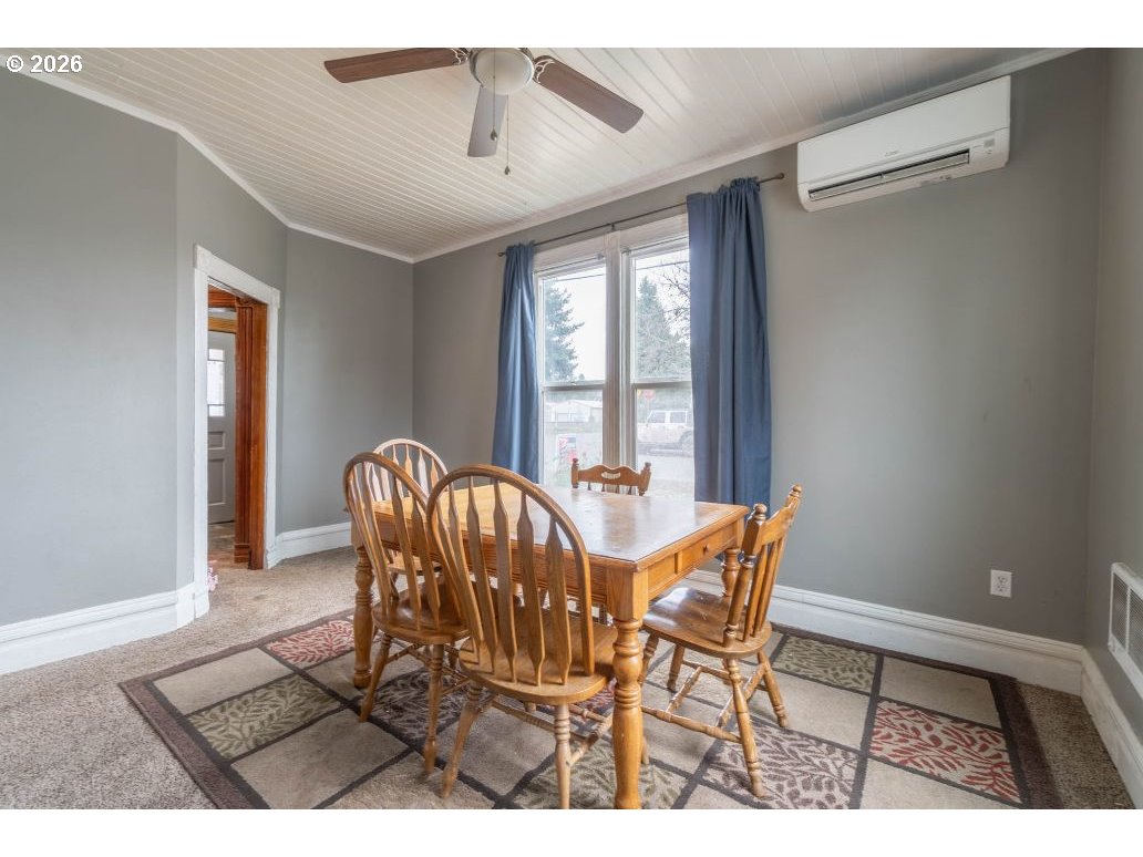 243 North Lane Street Cottage Grove, OR 97424 - Photo 6 of 22 a view of a dining room with furniture and window