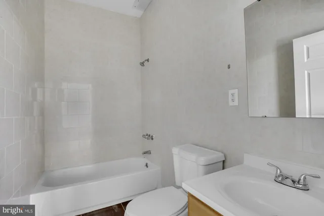 a bathroom with a sink toilet and bathtub