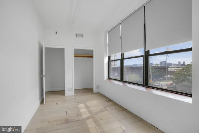 a view of an empty room with a window