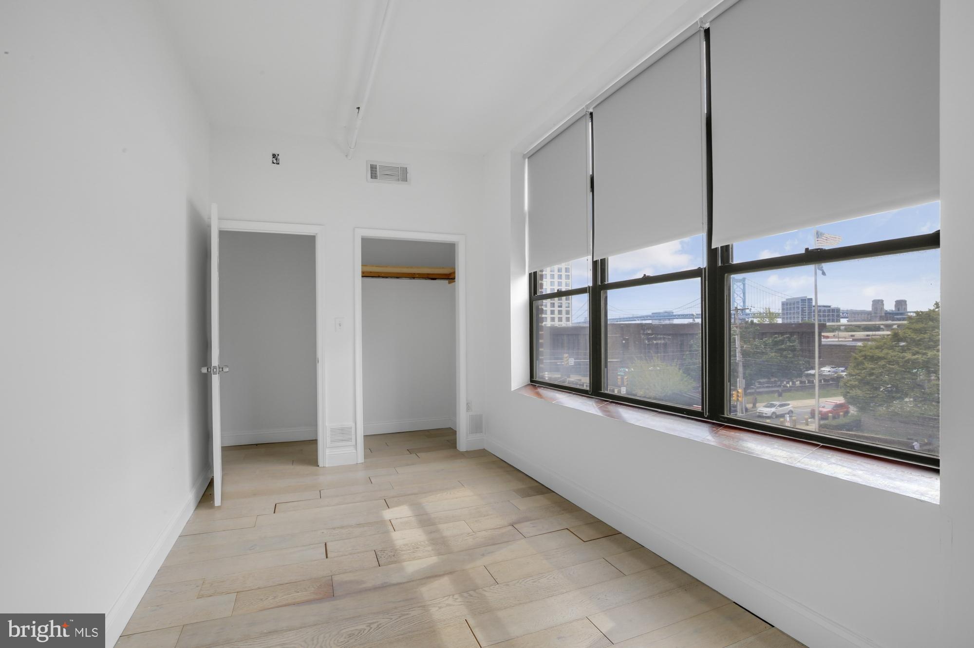 301 Spring Garden Street, Unit 3B Philadelphia, PA 19123 - Photo 17 of 22 a view of an empty room with a window