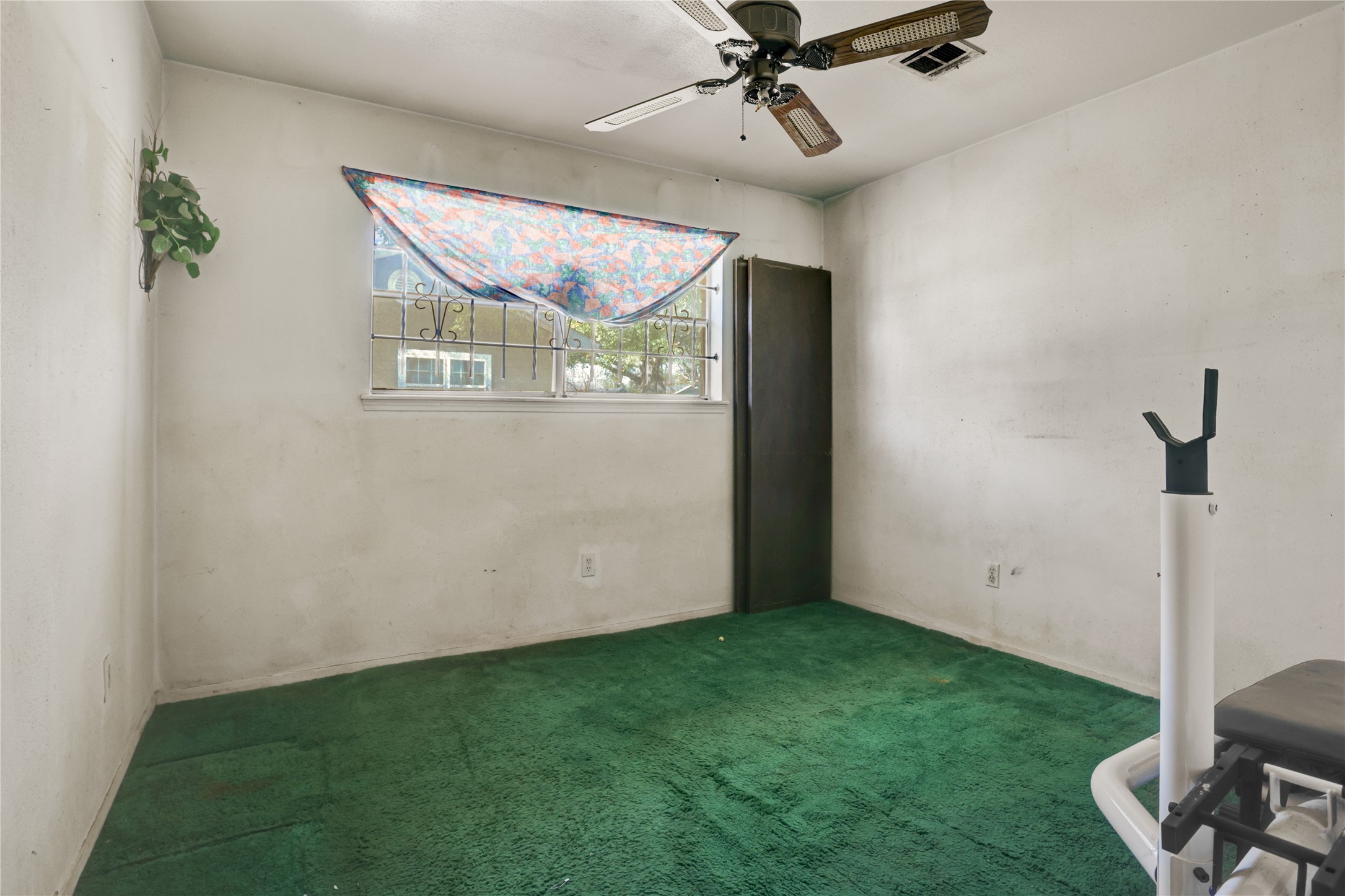 4422 Trigg Street Houston, TX 77093 - Photo 11 of 17 a view of room with a ceiling fan