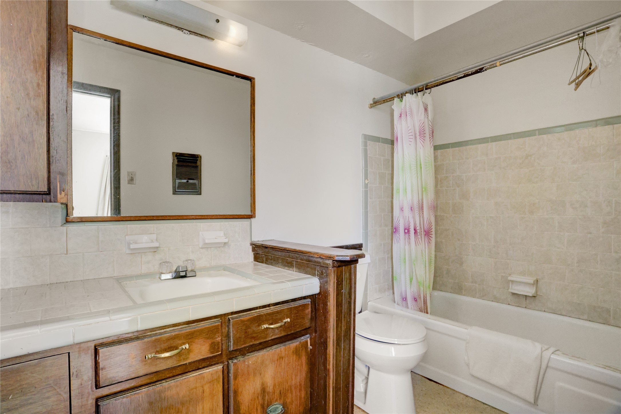 4422 Trigg Street Houston, TX 77093 - Photo 14 of 17 a bathroom with a sink a toilet and shower