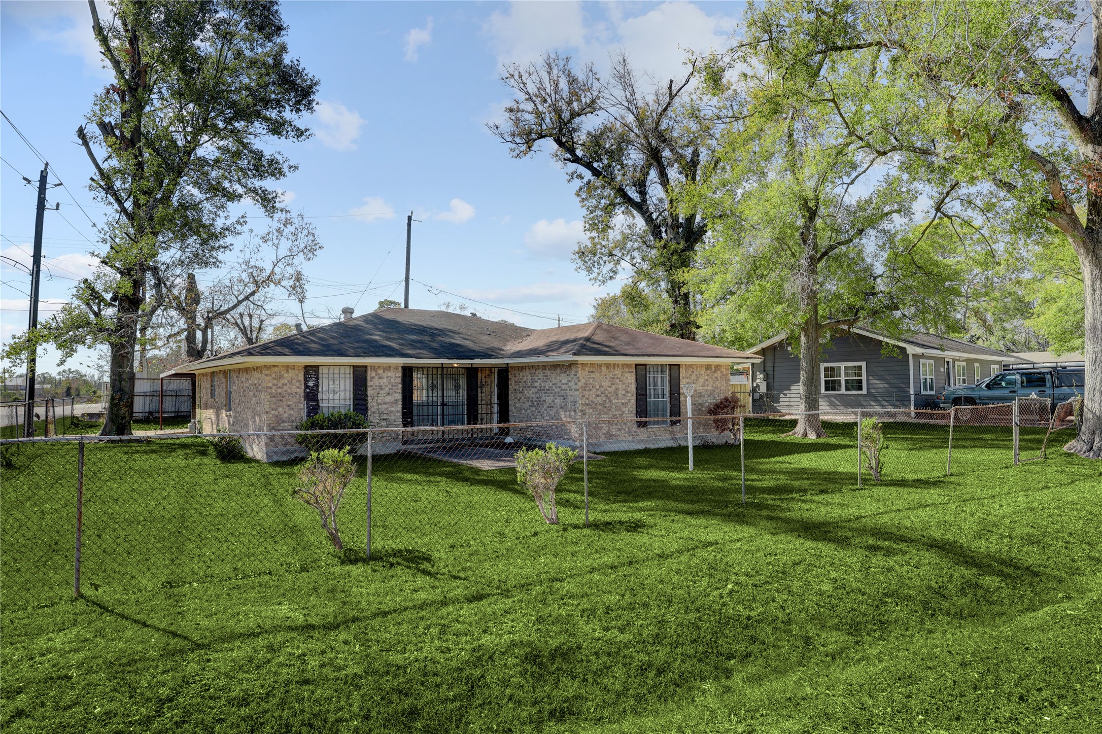 4422 Trigg Street Houston, TX 77093 - Photo 16 of 17 a backyard of a house with garden and trees