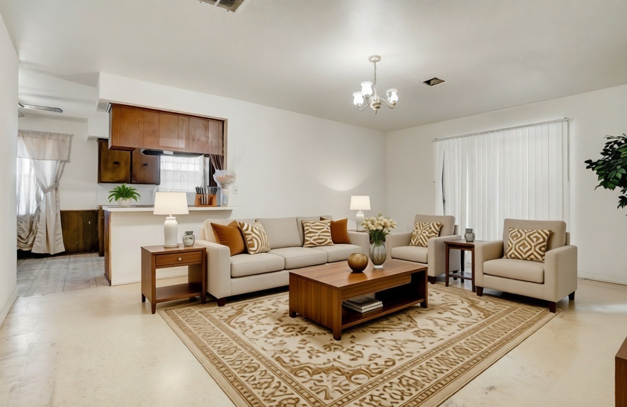 4422 Trigg Street Houston, TX 77093 - Photo 2 of 17 a living room with furniture and a chandelier