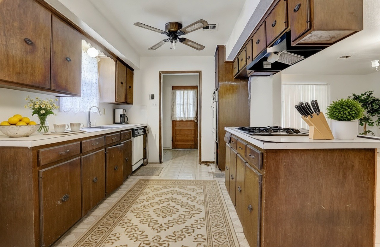 4422 Trigg Street Houston, TX 77093 - Photo 5 of 17 a kitchen with a sink appliances and cabinets