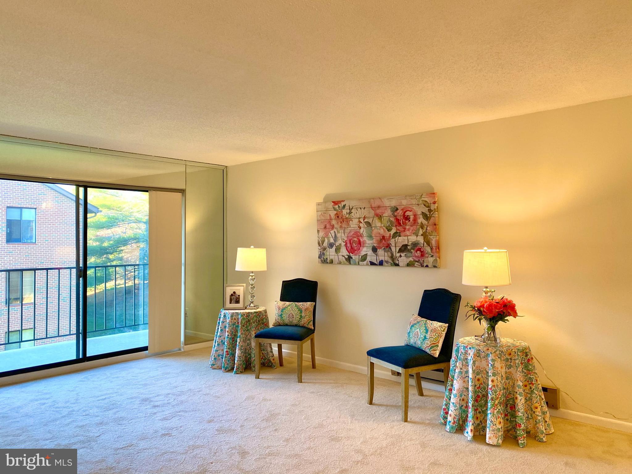 15311 Beaverbrook Court, Unit 902A Silver Spring, MD 20906 - Photo 10 of 38 Living room and sliding doors to balcony