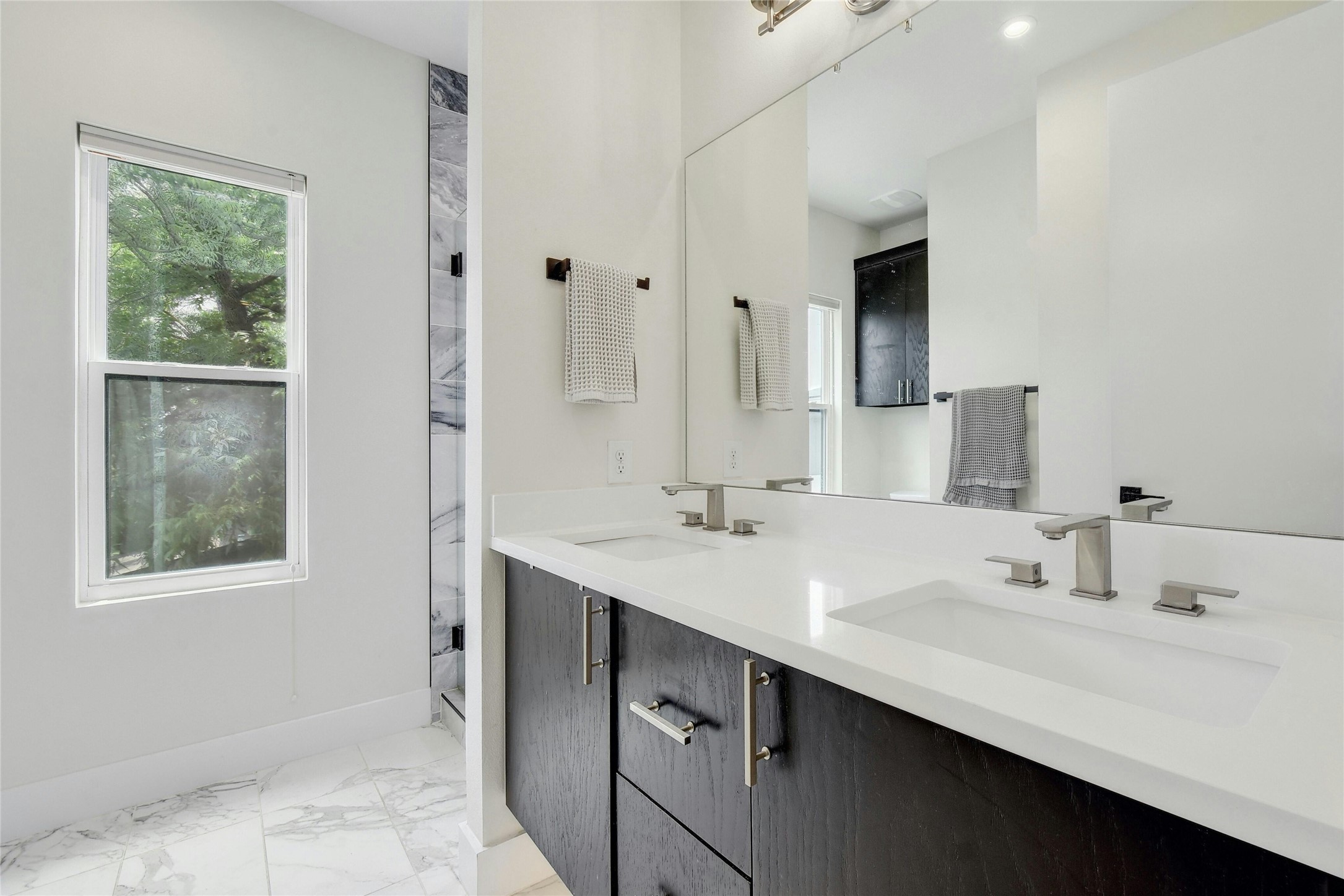 4606 Ledesma Road, Unit 2 Austin, TX 78721 - Photo 19 of 33 Dual vanity with sleek, integrated sinks provides ample space and modern design.
