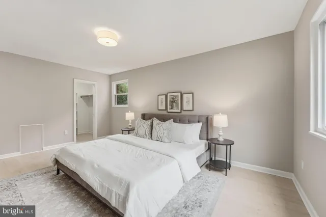 a bedroom with a bed and a lamp