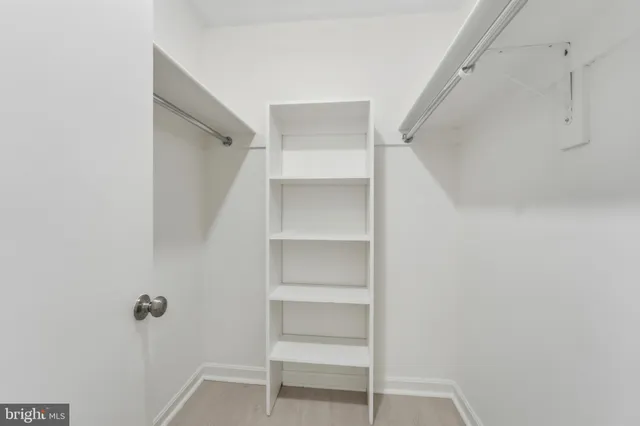 a view of an empty walk in closet