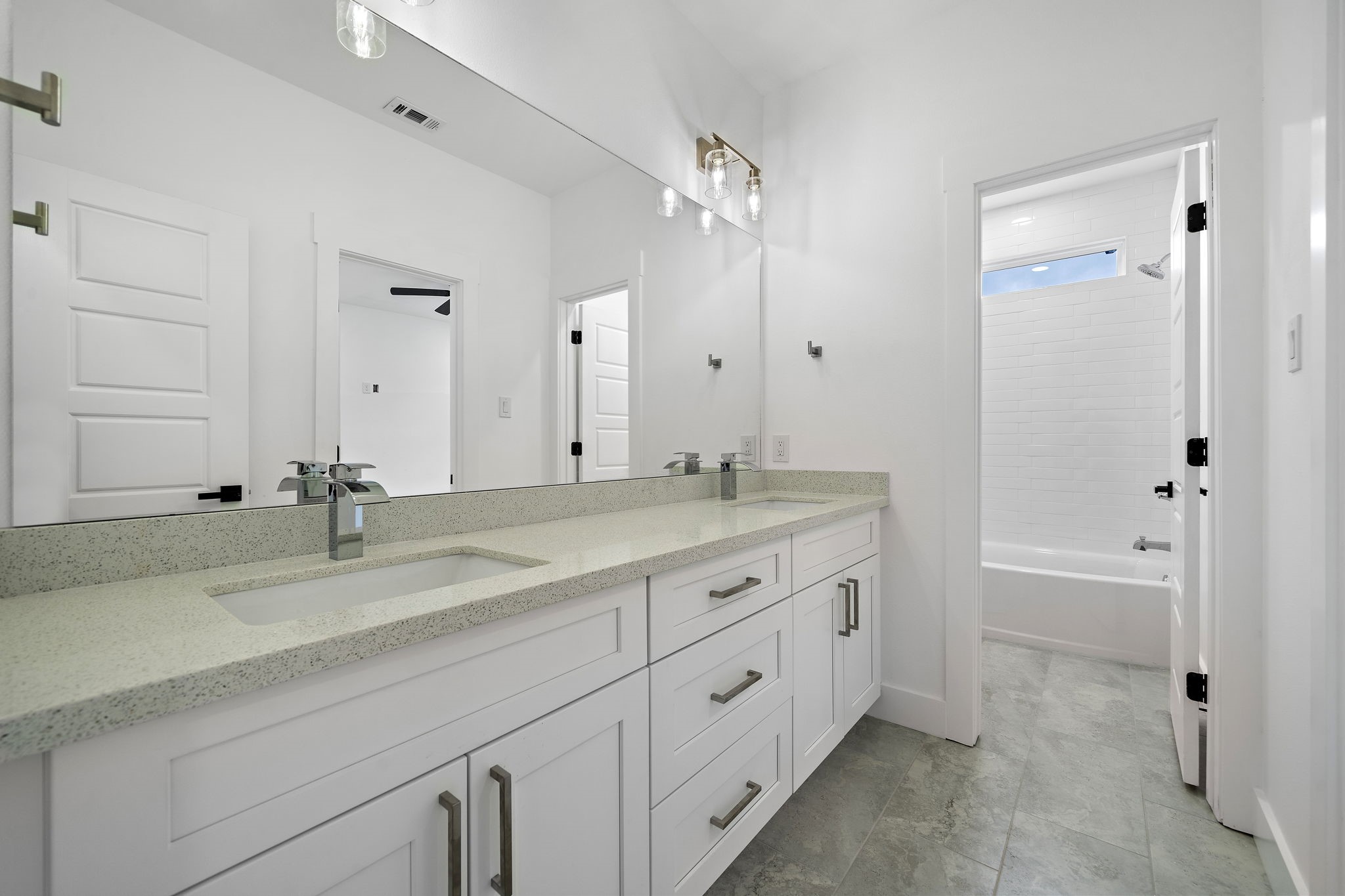 4012 Cetti Street Houston, TX 77009 - Photo 11 of 19 a bathroom with double vanity sink and a mirror