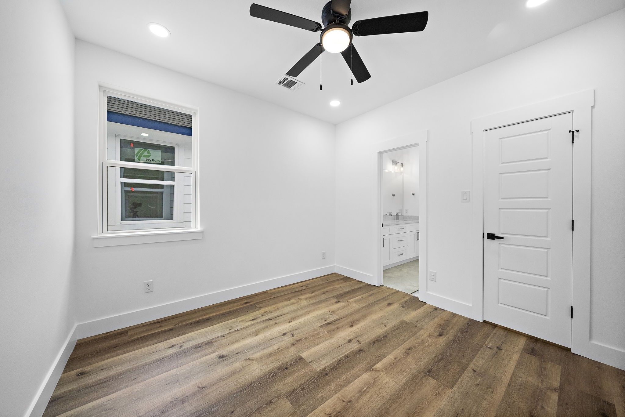 4012 Cetti Street Houston, TX 77009 - Photo 13 of 19 a view of empty room with wooden floor and window
