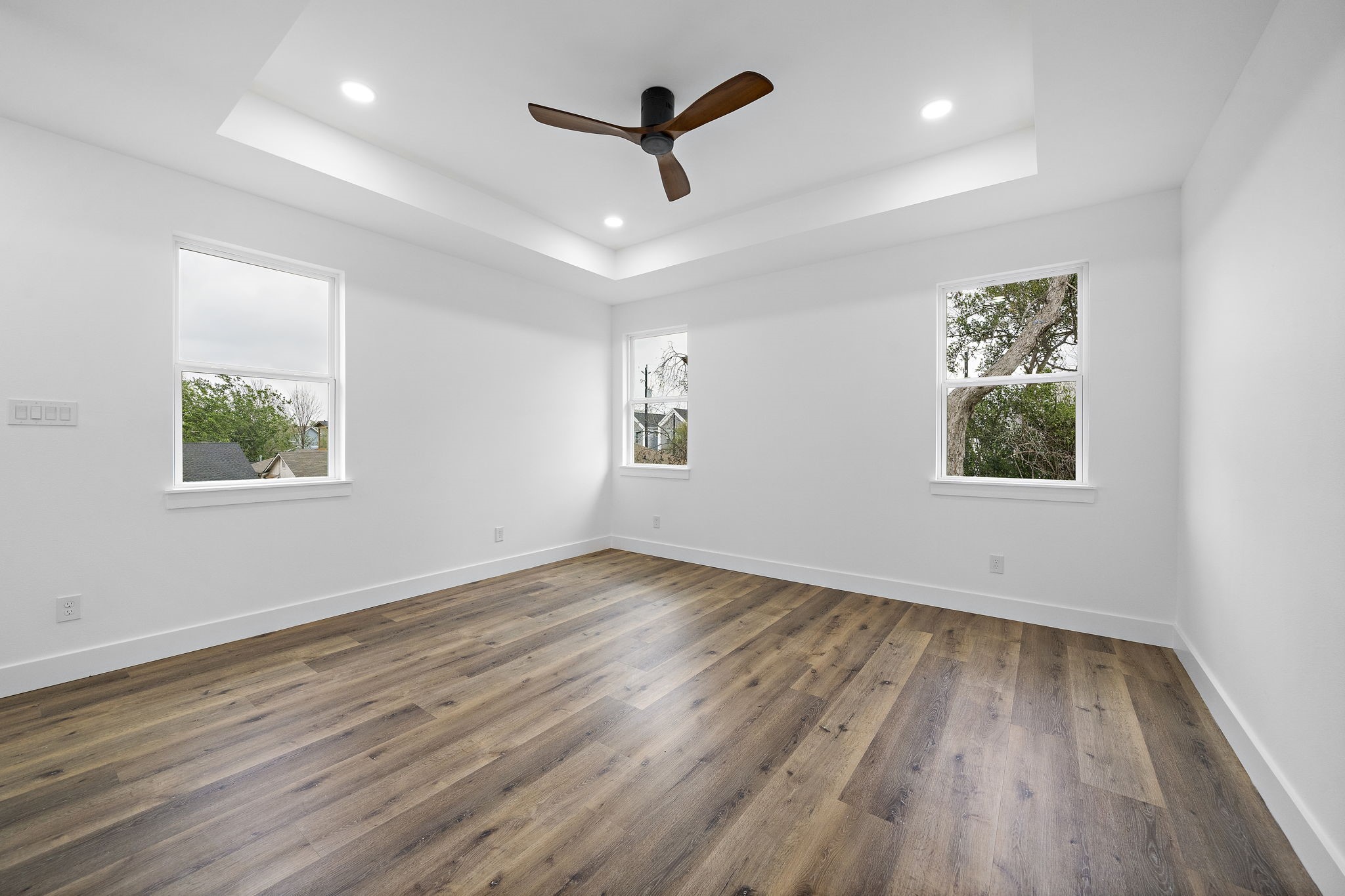4012 Cetti Street Houston, TX 77009 - Photo 14 of 19 an empty room with wooden floor ceiling fan and windows