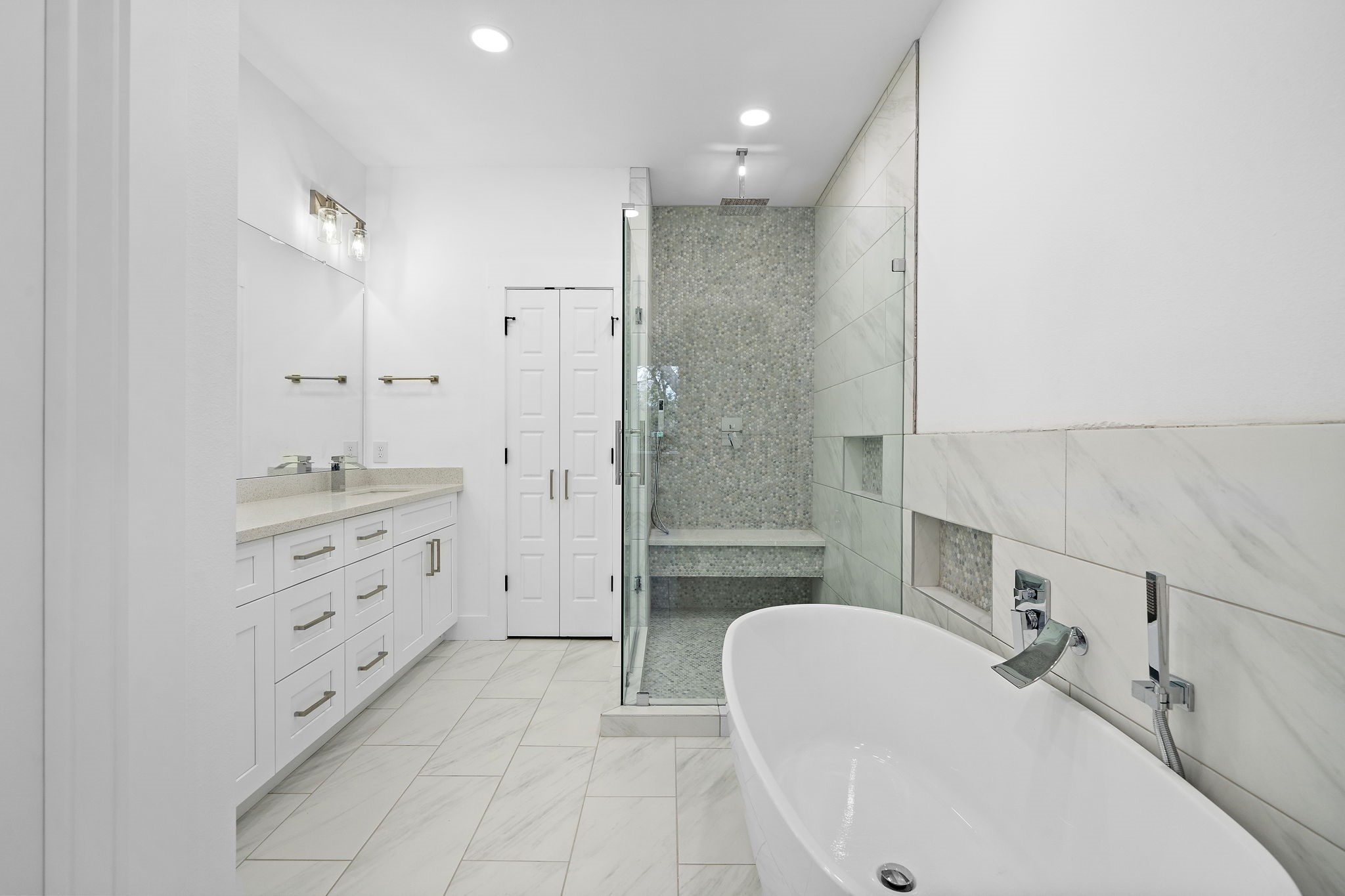 4012 Cetti Street Houston, TX 77009 - Photo 16 of 19 a bathroom with a tub sink double vanity and a mirror