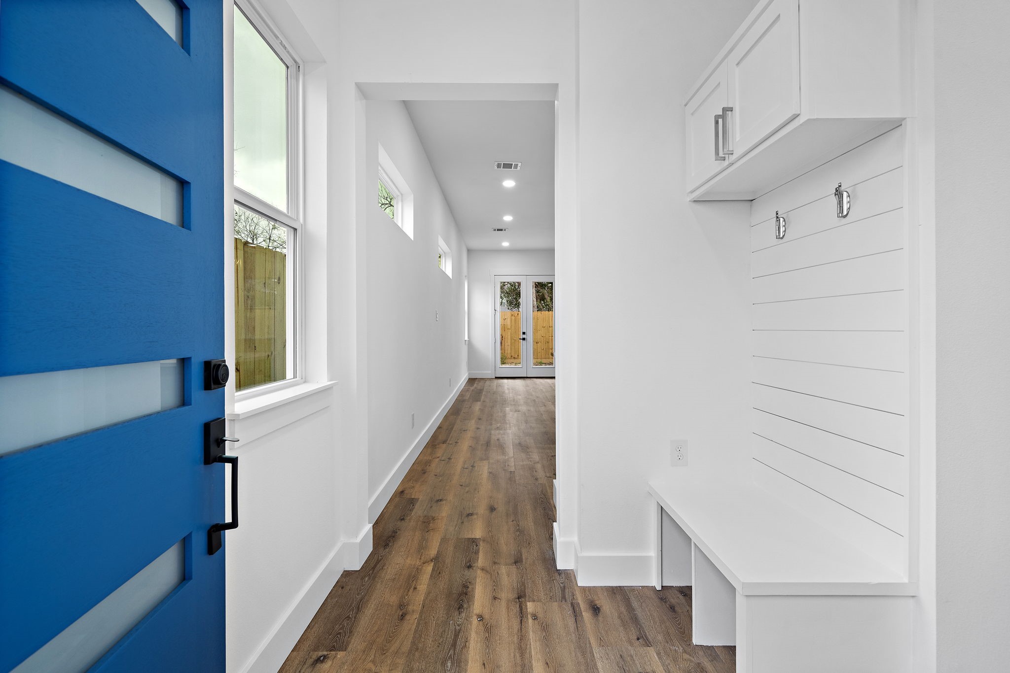 4012 Cetti Street Houston, TX 77009 - Photo 4 of 19 a view of a hallway with wooden floor and staircase