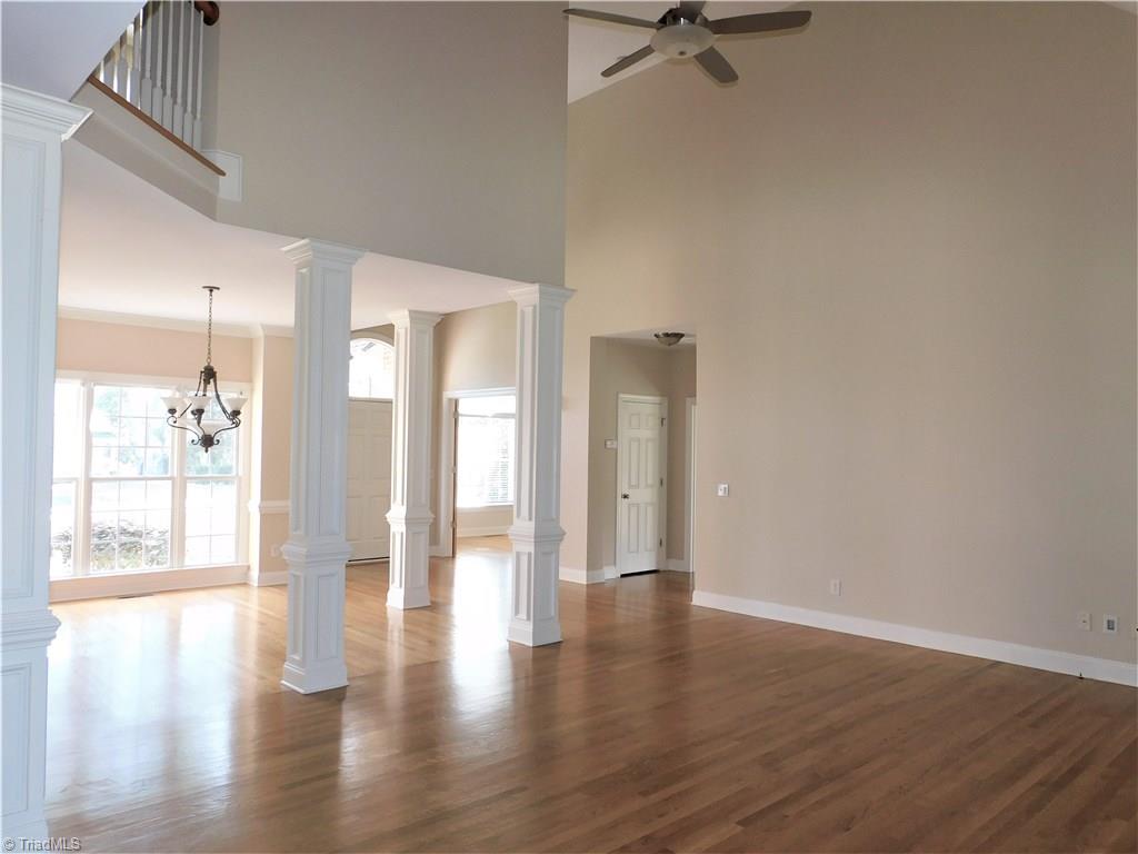 6007 Chalet Drive Oak Ridge, NC 27310 - Photo 4 of 30 Fluted columns adorn the dining area and living room of this custom featured home.