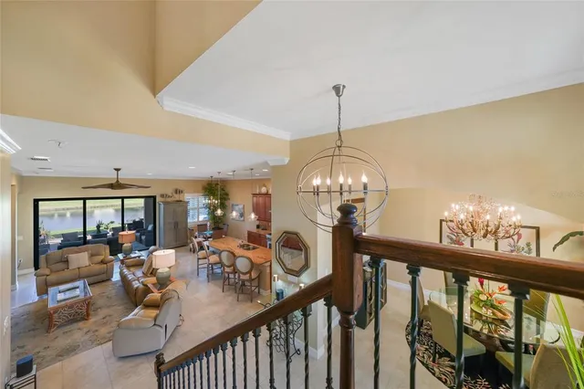 a view of a livingroom with furniture a chandelier