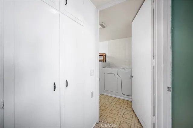 a spacious bathroom with a double vanity sink and a mirror
