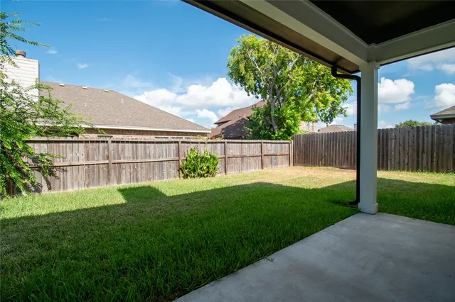 a view of backyard with green space