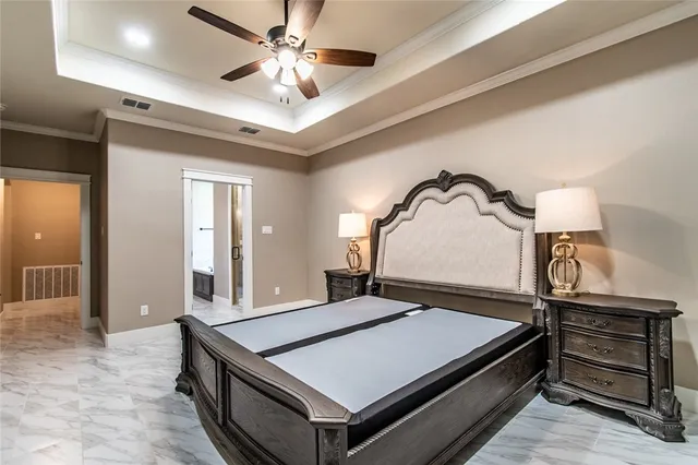 a bedroom with a bed and a dresser