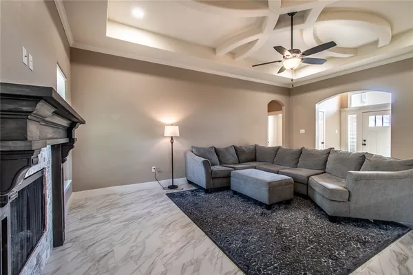 a kitchen with stainless steel appliances granite countertop wooden cabinets a refrigerator a sink and a stove