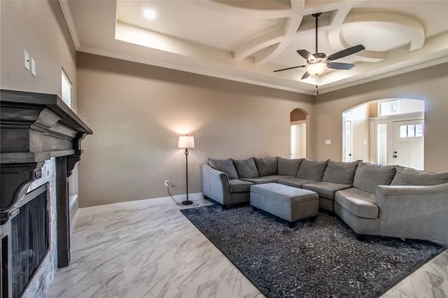 a kitchen with stainless steel appliances granite countertop wooden cabinets a refrigerator a sink and a stove