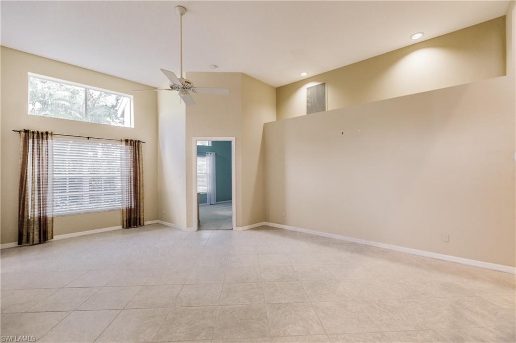 131 Napa Ridge Way Naples, FL 34119 - Photo 10 of 34 a view of an empty room with a window