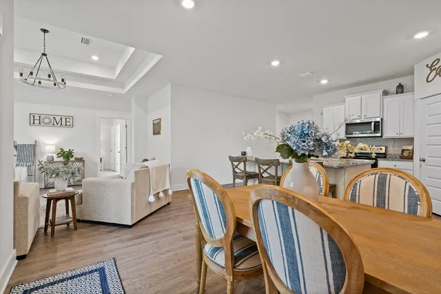 a dining room with furniture and window