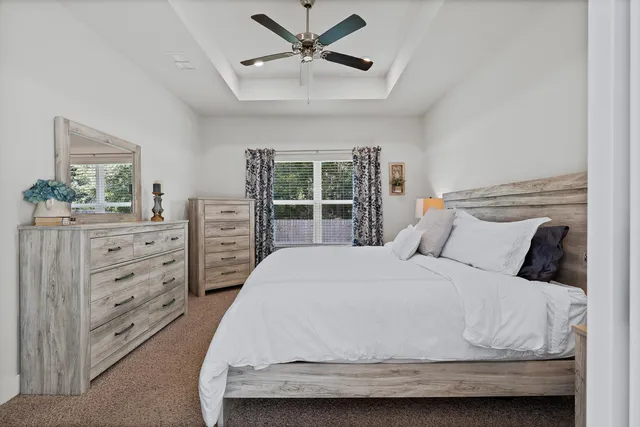 a bedroom with a bed and a dresser