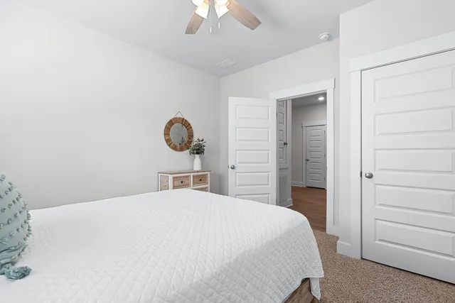 a bed room with a bed and a chandelier