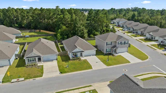 an aerial view of a house with swimming pool