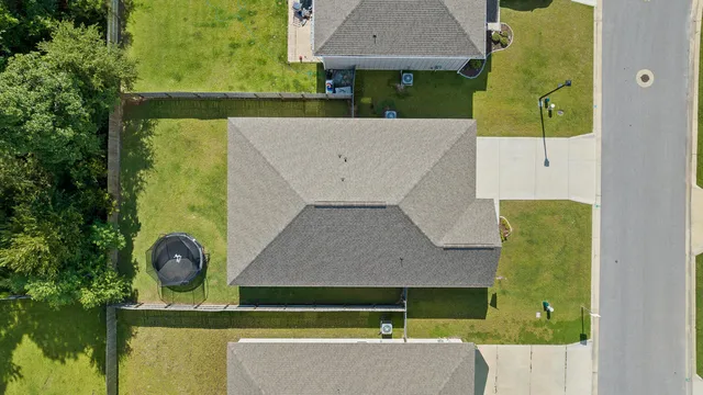 a view of a swimming pool with a table and chairs
