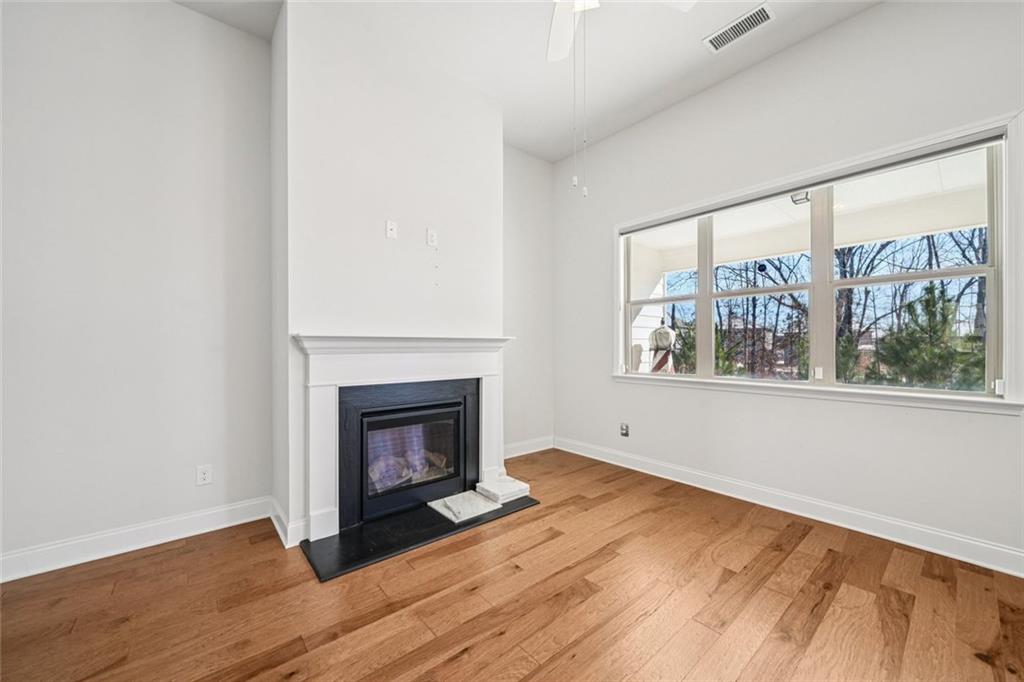 3431 High Shoals Buford, GA 30519 - Photo 12 of 51 a view of an empty room with wooden floor and a window