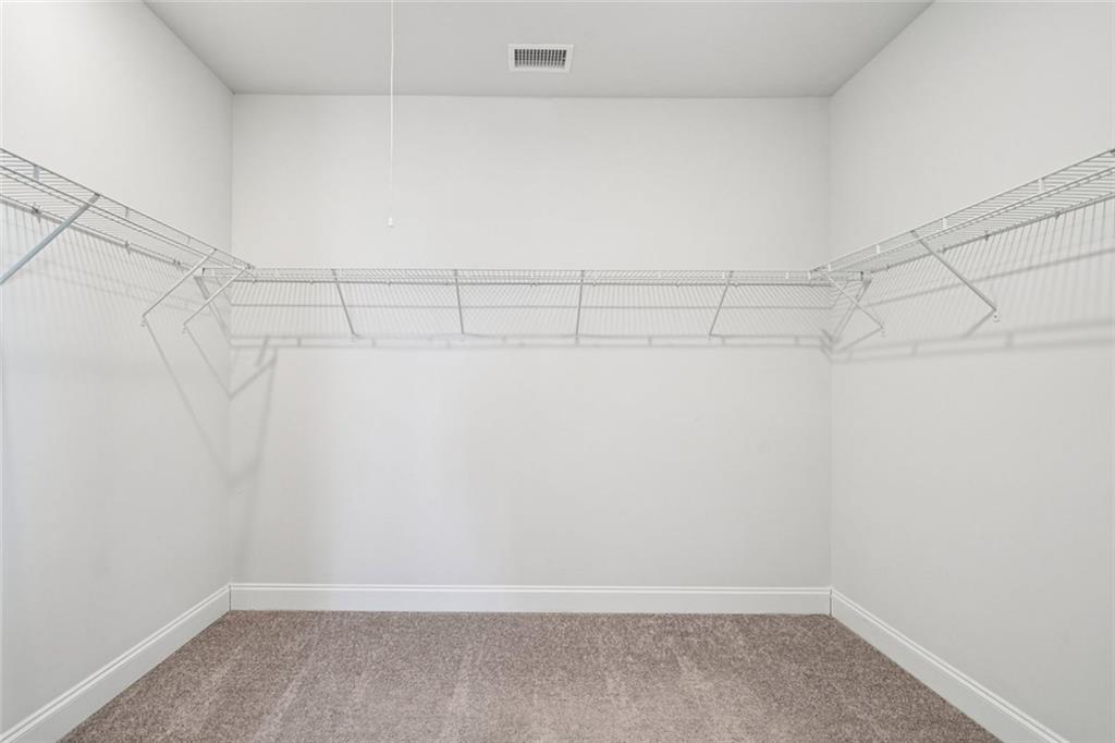3431 High Shoals Buford, GA 30519 - Photo 19 of 51 a view of a room with racks on the wall