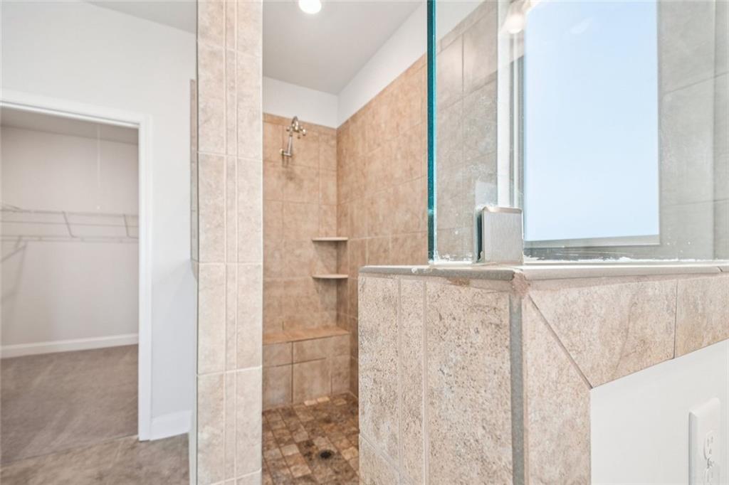 3431 High Shoals Buford, GA 30519 - Photo 20 of 51 a bathroom with a window and a shower